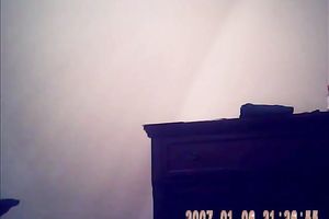 Hidden camera of lustful bulky dark brown putting on her raiment after shower