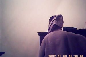 Hidden camera of lustful bulky dark brown putting on her raiment after shower