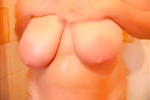 Chubby wench with saggy large tits was taking a soapy shower on camera