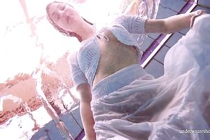 Cute and hawt Russian redhead legal age teenager filmed undressed in the pool underwater