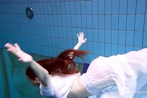 Cute and hawt Russian redhead legal age teenager filmed undressed in the pool underwater