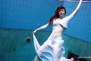 Cute and hawt Russian redhead legal age teenager filmed undressed in the pool underwater