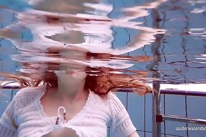 Cute and hawt Russian redhead legal age teenager filmed undressed in the pool underwater