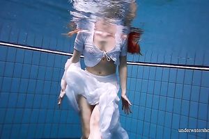 Cute and hawt Russian redhead legal age teenager filmed undressed in the pool underwater