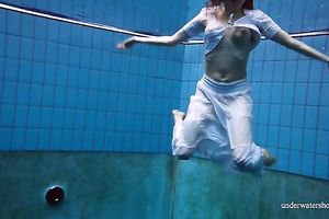 Cute and hawt Russian redhead legal age teenager filmed undressed in the pool underwater