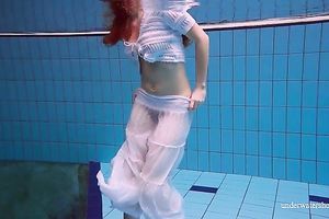 Cute and hawt Russian redhead legal age teenager filmed undressed in the pool underwater