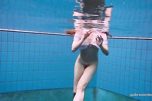 Cute and hawt Russian redhead legal age teenager filmed undressed in the pool underwater