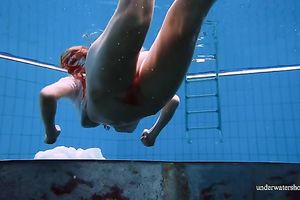 Cute and hawt Russian redhead legal age teenager filmed undressed in the pool underwater