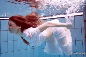 Cute and hawt Russian redhead legal age teenager filmed undressed in the pool underwater