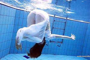 Cute and hawt Russian redhead legal age teenager filmed undressed in the pool underwater