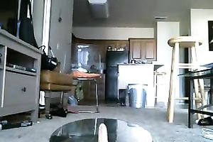 Slender brunette beauty jumps on a fake penis in front of a web camera