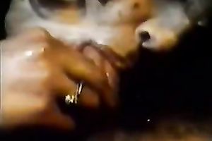 Greased up classic blond chick eats cock in the gym