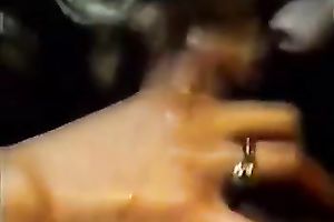 Greased up classic blond chick eats cock in the gym