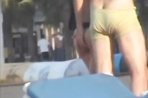 Sweet lean dark brown honey topless on the beach getting groped