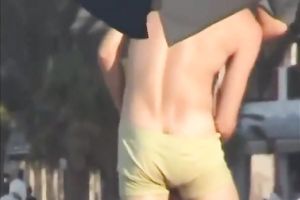 Sweet lean dark brown honey topless on the beach getting groped