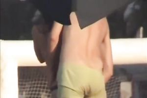 Sweet lean dark brown honey topless on the beach getting groped