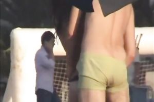 Sweet lean dark brown honey topless on the beach getting groped