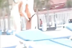 Sweet lean dark brown honey topless on the beach getting groped