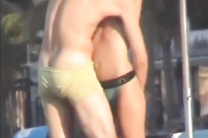 Sweet lean dark brown honey topless on the beach getting groped