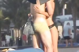 Sweet lean dark brown honey topless on the beach getting groped