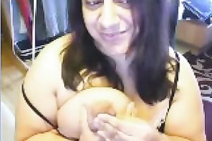 Ugly as fuck web camera doxy plays with her actually massive boobies