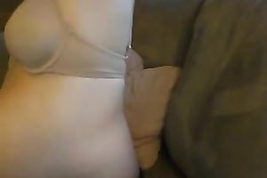 Short haired nerdy pregnant cheerful herself on the bed