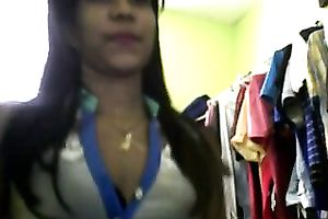 Sizzling Indian gal posing and stripping seductively in front of camera