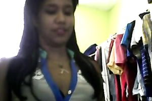 Sizzling Indian gal posing and stripping seductively in front of camera