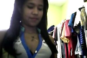 Sizzling Indian gal posing and stripping seductively in front of camera