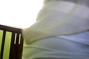 Sizzling Indian gal posing and stripping seductively in front of camera