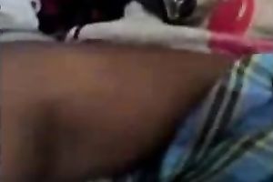 Playful Bangladeshi youthful pair having enjoyment in sofa