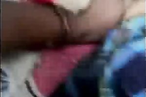 Playful Bangladeshi youthful pair having enjoyment in sofa