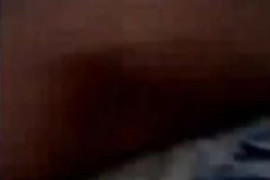 Playful Bangladeshi youthful pair having enjoyment in sofa