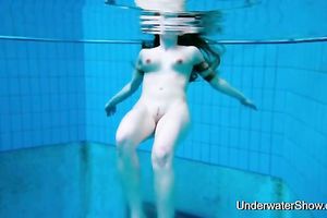 Pale skin breasty redhead legal age teenager chick completely undressed in the pool