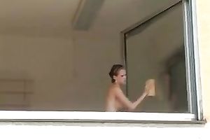 Magnificent and breasty blond honey washed the windows topless