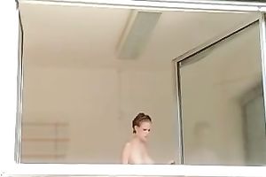 Magnificent and breasty blond honey washed the windows topless
