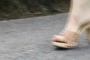 My romantic babe shows off her bawdy soles outdoors