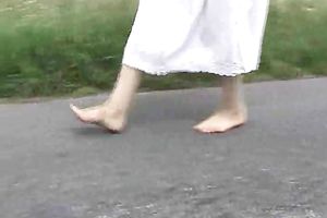 My romantic babe shows off her bawdy soles outdoors