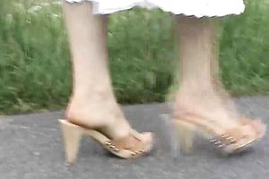 My romantic babe shows off her bawdy soles outdoors