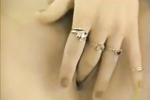 Petite babe with slim legs masturbating with a vibrator