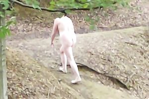 My lewd honey is playing with her bald fur pie in the forest