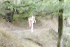 My lewd honey is playing with her bald fur pie in the forest