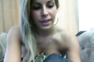 Outrageous blond playgirl gently fingers her rectal hole on web camera
