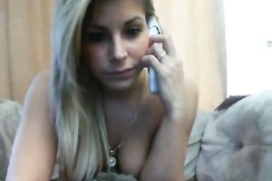 Outrageous blond playgirl gently fingers her rectal hole on web camera