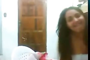 Kinky web camera housewife flashed her natural milk shakes during the time that posing in white nightie