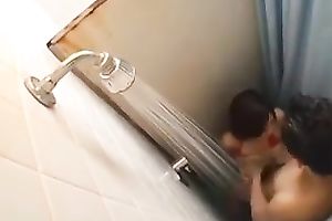 Short haired cute Japanese brunette was screwed right in the shower cabin