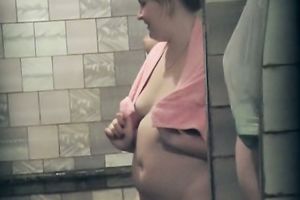 Fat white ladies in the shower room drying after washing