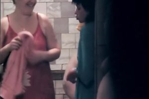 Fat white ladies in the shower room drying after washing