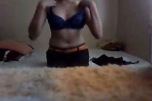 Slender legal age teenager disrobes in front of a web camera and plays with her lovely cum-hole
