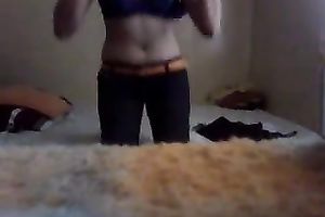 Slender legal age teenager disrobes in front of a web camera and plays with her lovely cum-hole